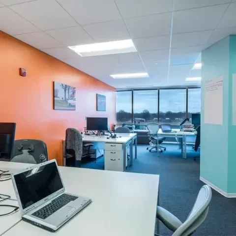 Spacious, bright team office at AdvantEdge Chevy Chase with ergonomic seating and large windows offering natural light.